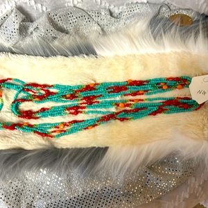 8 strand turquoise, orange and red beaded necklace.